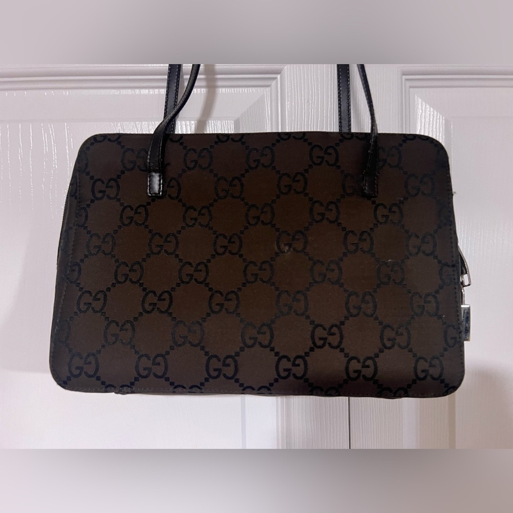 Gucci Signature GG Canvas Shoulder Bag in Brown With Black Lettering